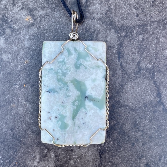 Wrapped stone pendant on cord. - Picture 2 of 2